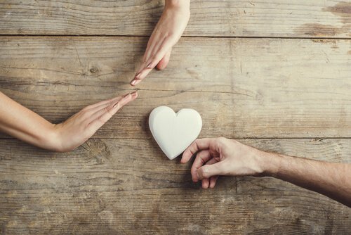 person giving heart being rejected