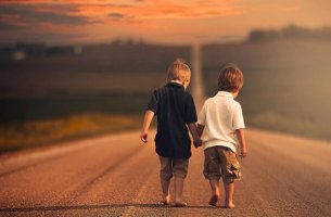 two little boys walking hand in hand