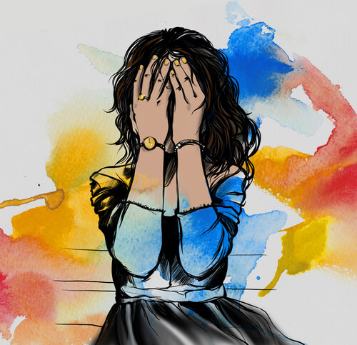 woman with hand covering face