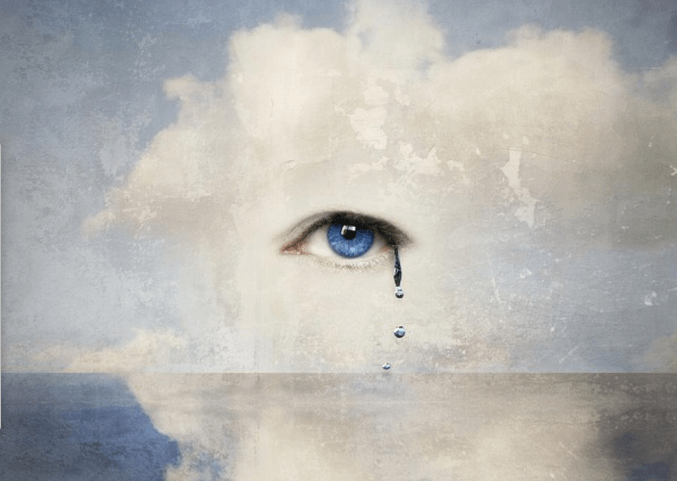 A blue eye crying into the ocean.