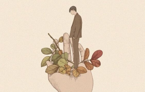 A man standing in an open hand.