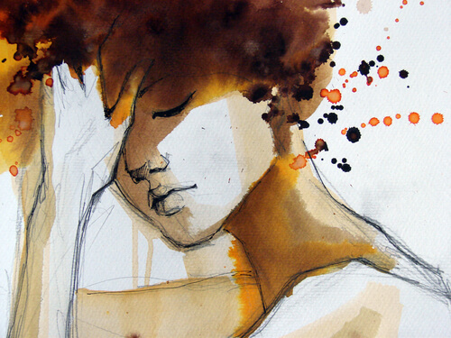 a woman looking down with her hand to her head