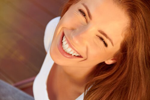 a woman smiling widely