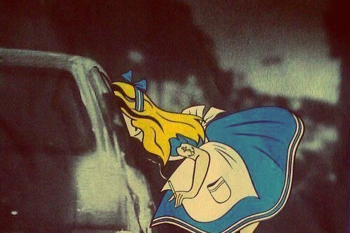 Alice in Wonderland smoking with a tattoo.