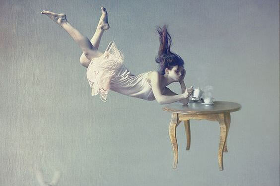 A fantastical scene of a woman falling with tea.