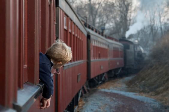 A little boy on a train.