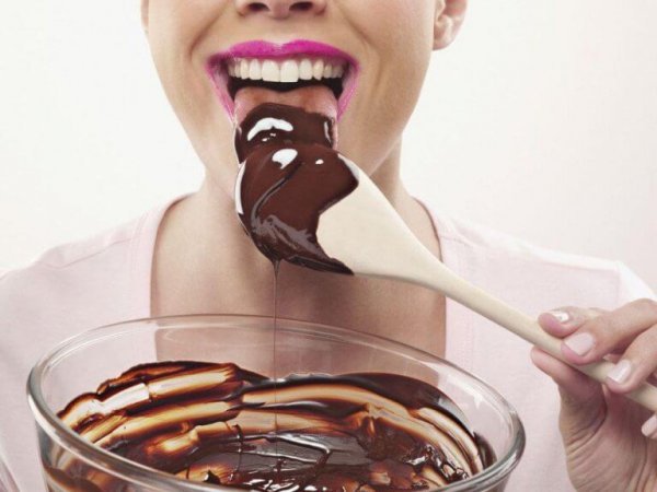 Eating chocolate from the spoon.