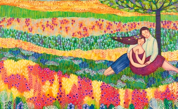 a happy couple in a colorful field of flowers