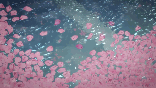 a gif of rain falling on a flower-covered lake