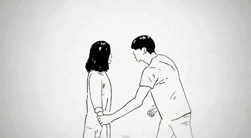 A gif of a couple hugging and being filled with color.