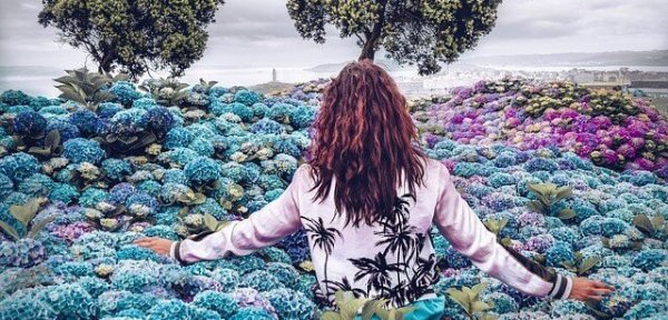 a woman in a field of flowers