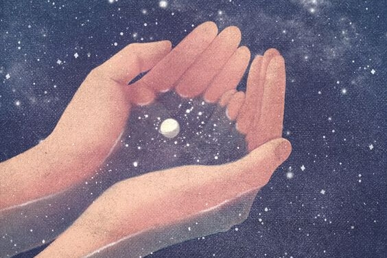 hands holding outer space