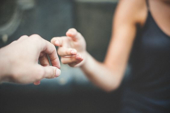 Hands touching.