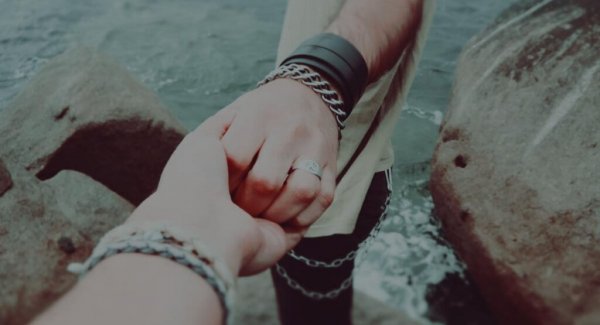 a couple holding hand, trusting and vulnerable