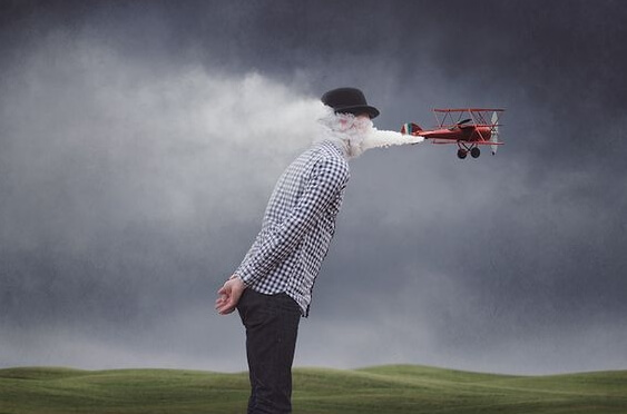 a plane blowing air into a man's face