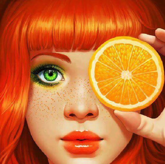 a girl with orange hair and green eyes puts an orange to her eye