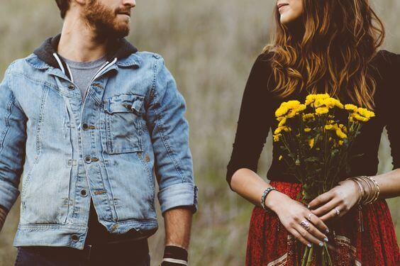 a couple, the girl holding yellow flowers