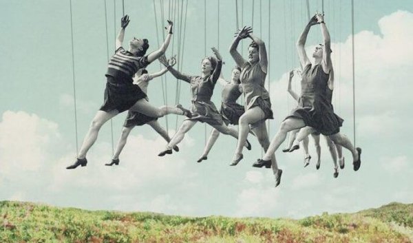 Puppet people leaping in a field.