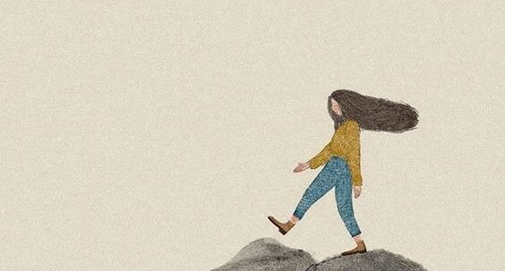 a girl walking on the mountaintop