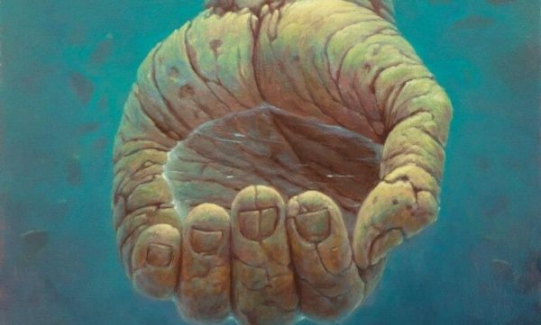 a stone hand in the water