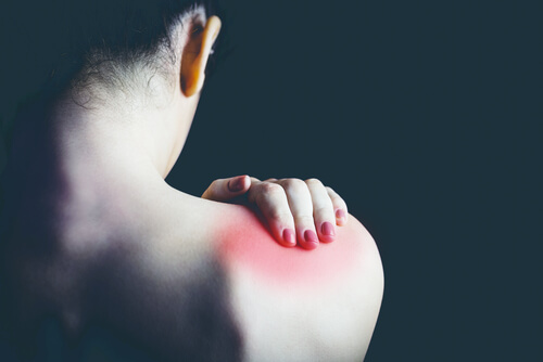 a woman with shoulder pain