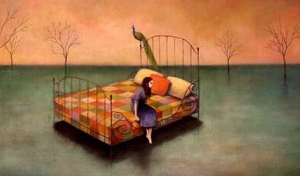 a tired woman sitting on the edge of her bed