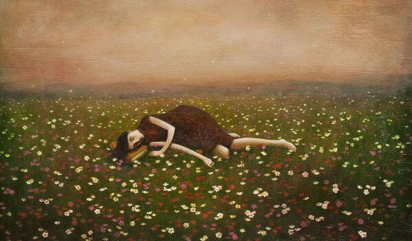 a woman lying in a field of flowers