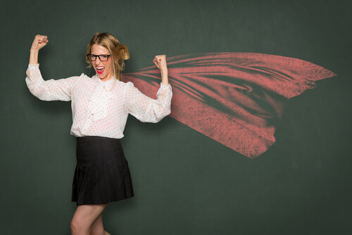 woman with a growth mindset, wearing glasses and a cape like superman