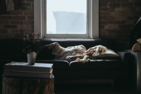 a woman sleeping on the couch