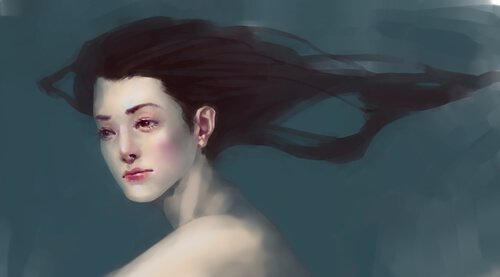 a woman swimming underwater