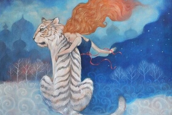 a girl with her white tiger