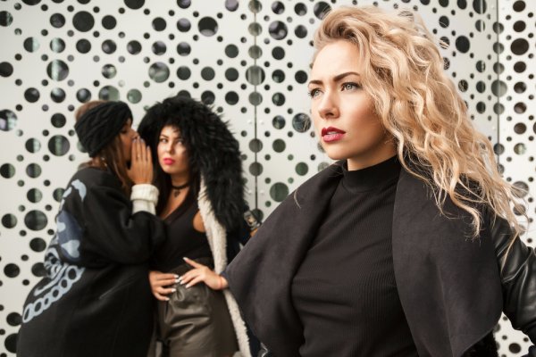 A person talking bad about another.