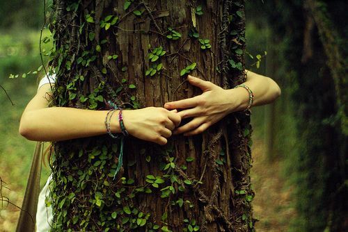 A girl hugging a tree in gratitude