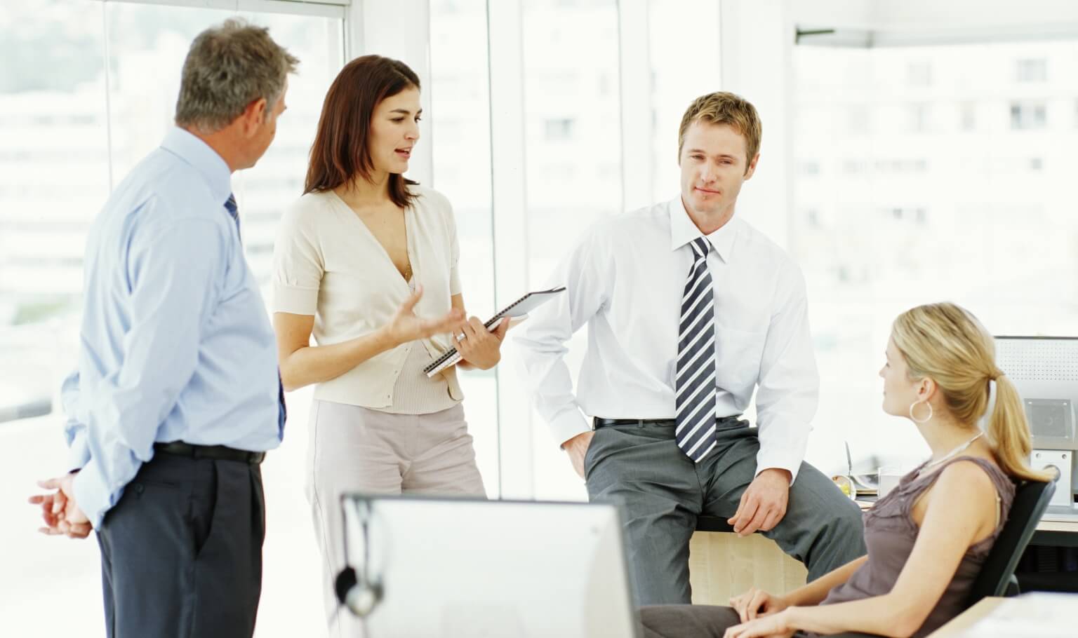 A group of adults are working together.