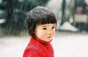 An Asian little girl is sad.