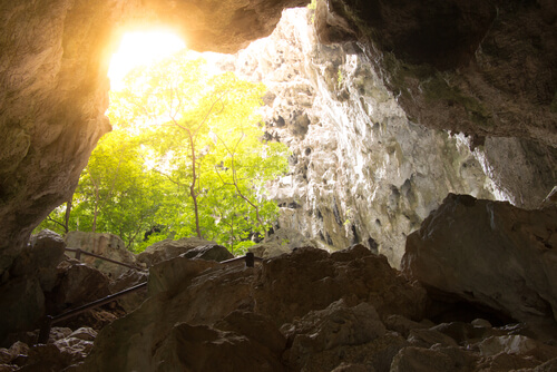 a cave with light shining in