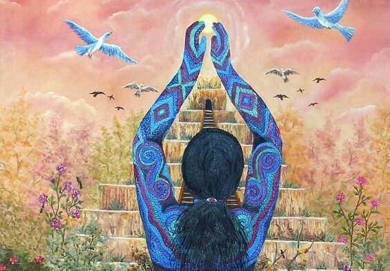 Colorful blue woman with arms towards the sun.