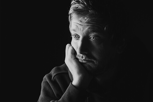 a distrustful man with pistanthrophobia