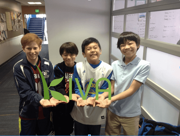 Four boys advertising Kiva method.