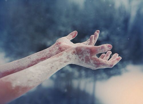 frozen hands reaching out from a heart of ice
