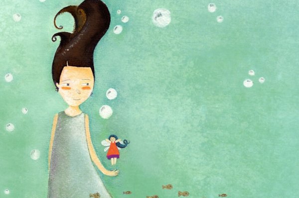 a girl playing with her doll