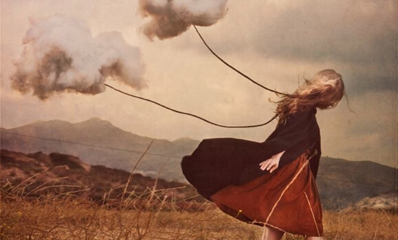 a girl carrying dark clouds