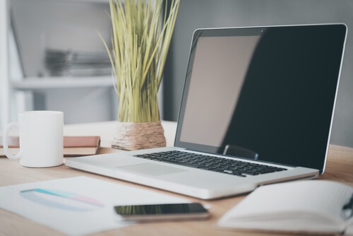 a laptop on a work desk