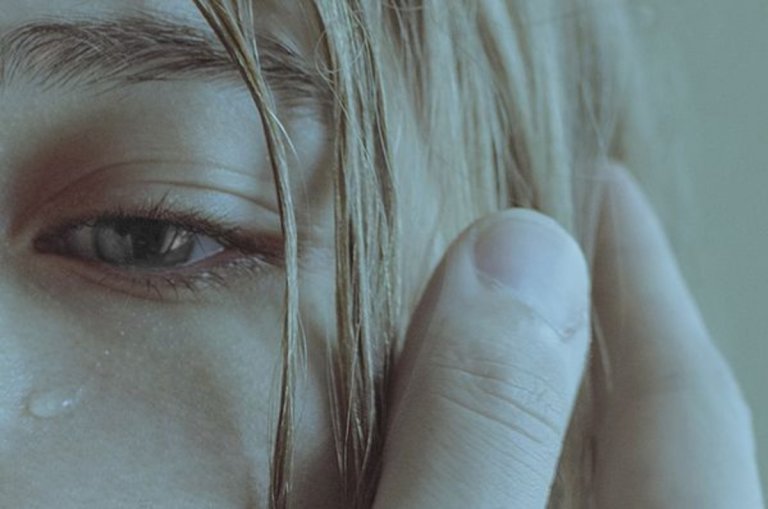woman crying a tear