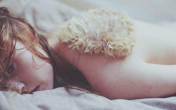 a sad girl laying down