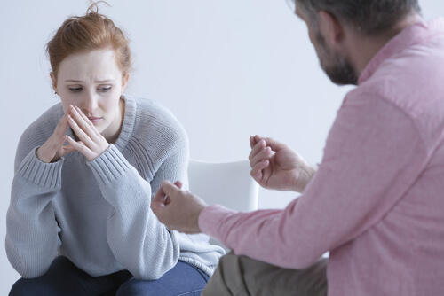a therapist explaining something to a distrustful patient
