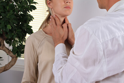 Woman having thyroid check