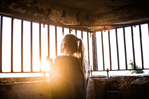 a girl looking into the sun