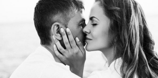 a couple whispering sweet nothings