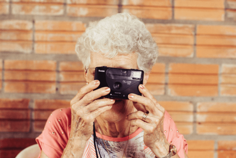 an older woman with dementia taking a picture